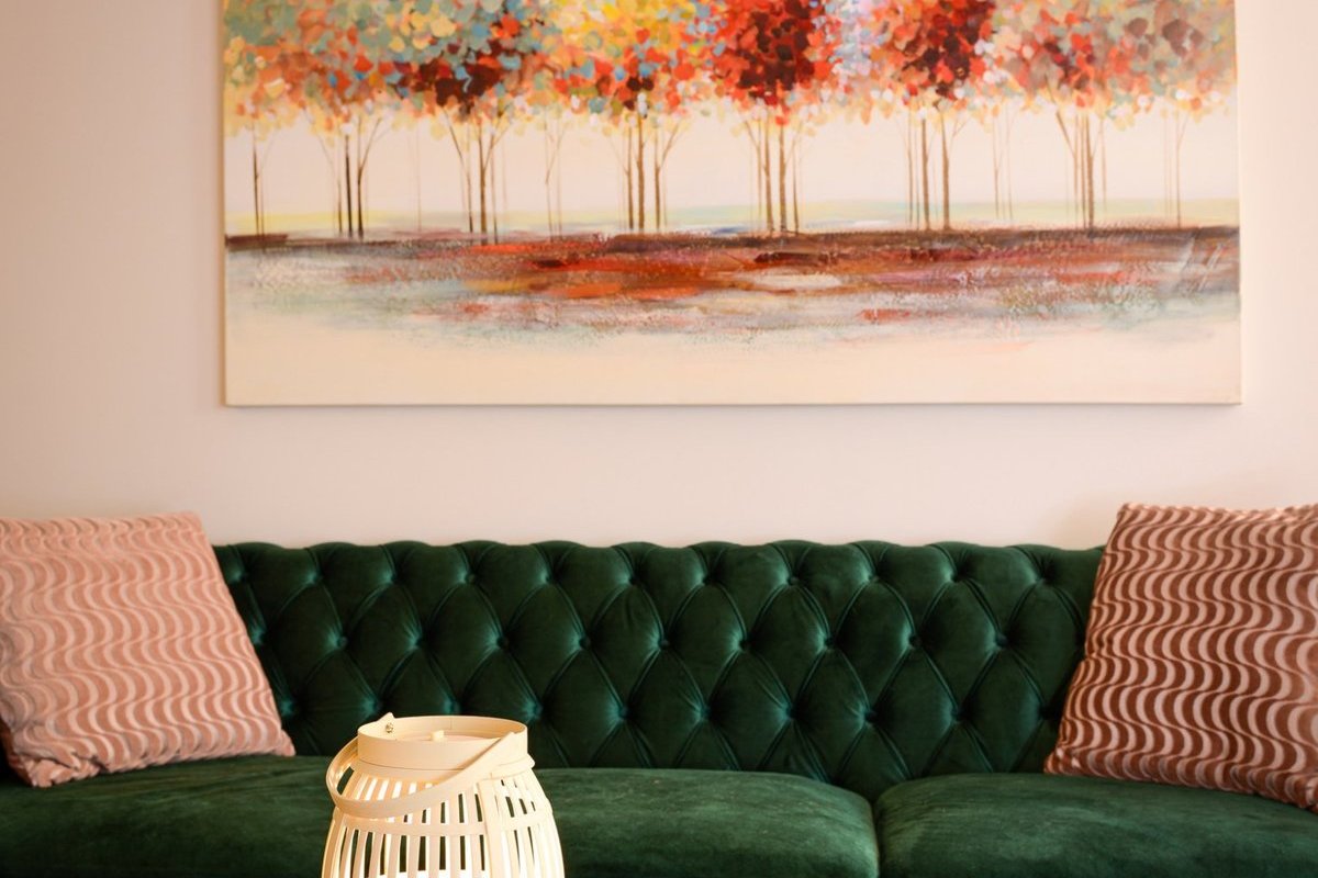 Lobby with green velvet sofa and tea service at Bodhi Salt Center